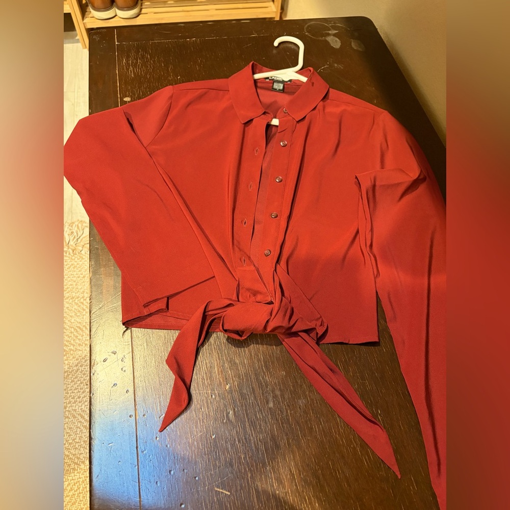 New without tags.  Beautiful deep red satin top